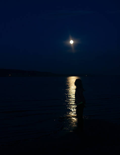 istock girl in the moon glow 492494890