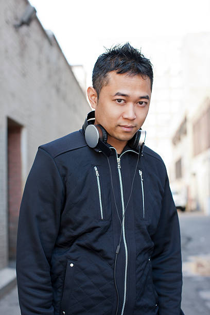 istock Handsome Asian Guy With Headphones 492495060