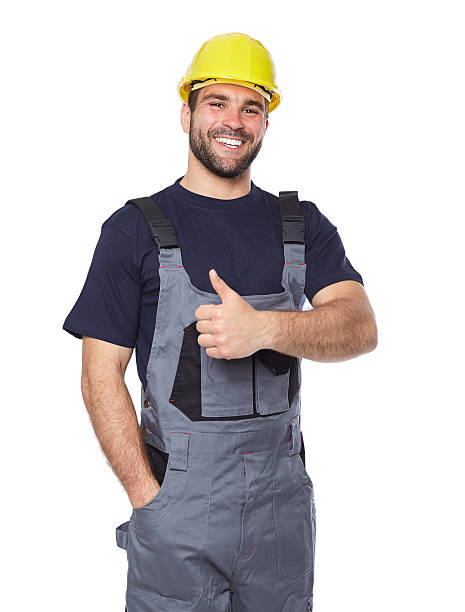 istock Portrait of smiling worker in gray uniform 492495119
