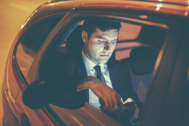 istock Businessman in a car at night 492498148