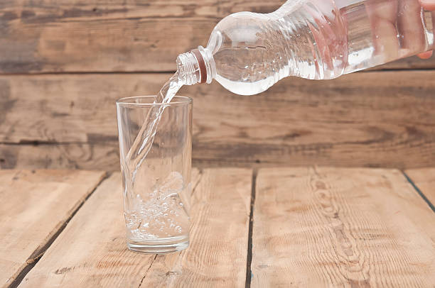istock Water pour on to glass 492498399