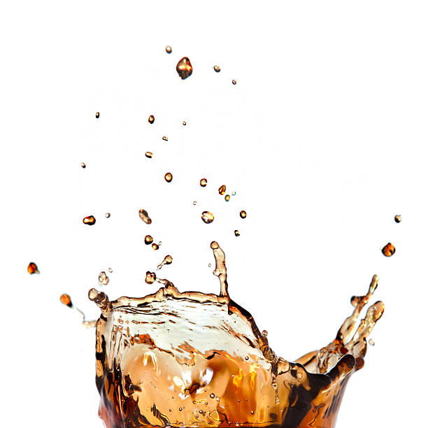 splash of cola isolated on white stock photo