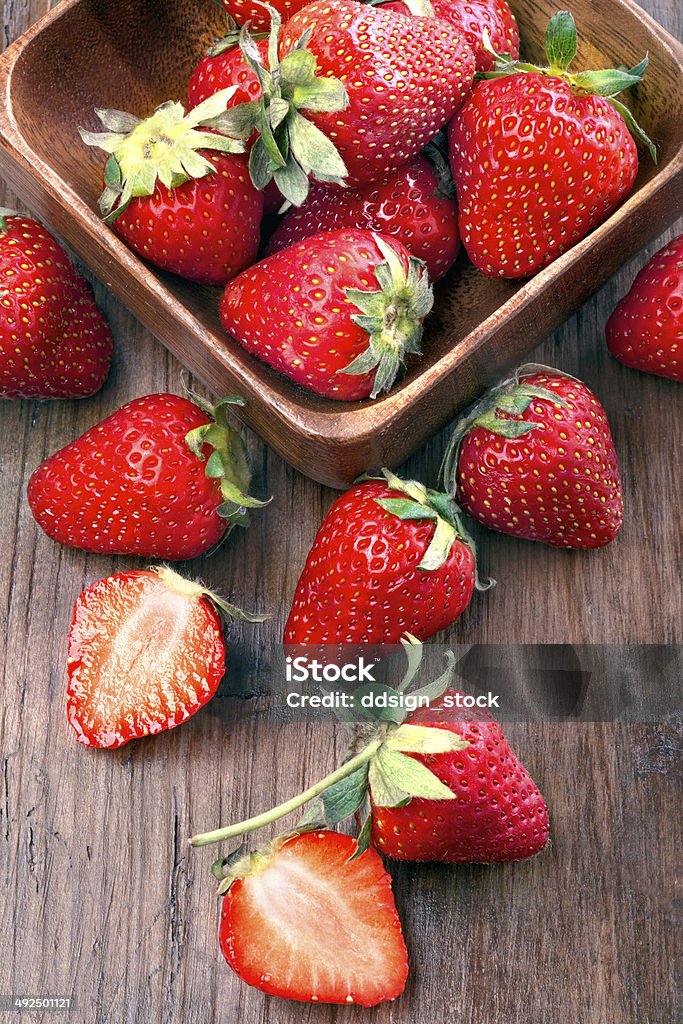 Strawberries healthily raised organic strawberries in a wooden bowls on the table Antioxidant Stock Photo