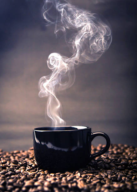 istock warm black cup of coffee on  roasted  beans 492508086