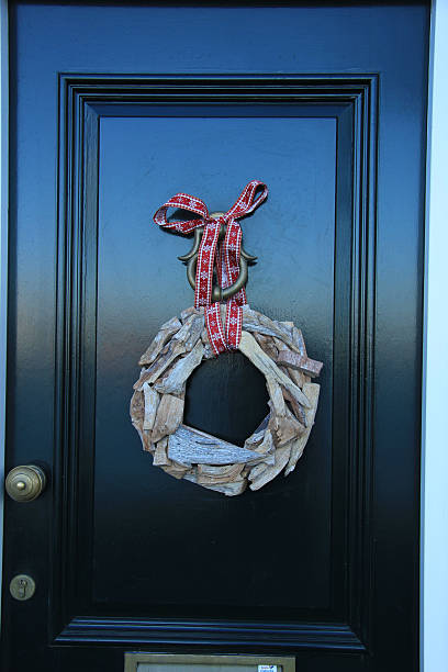 istock Classic christmas wreath with decorations on a door 492509518