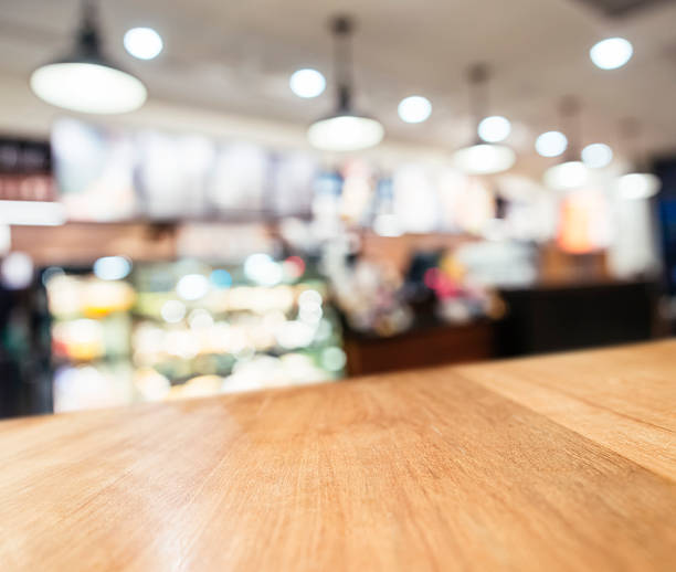 istock Table top Counter with Blurred Shop cafe Interior background 492511196