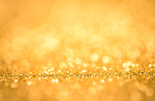 istock Abstract blur golden bokeh lighting from glitter texture 492511392