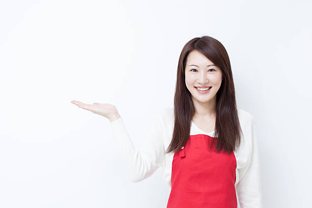 istock young woman with red apron 492512266