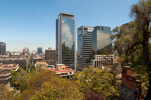 elevated view on modern Santiago skyline with mountain range in the background