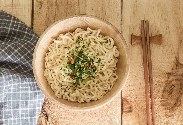 istock Instant noodles in bowl on wooden table 492513772