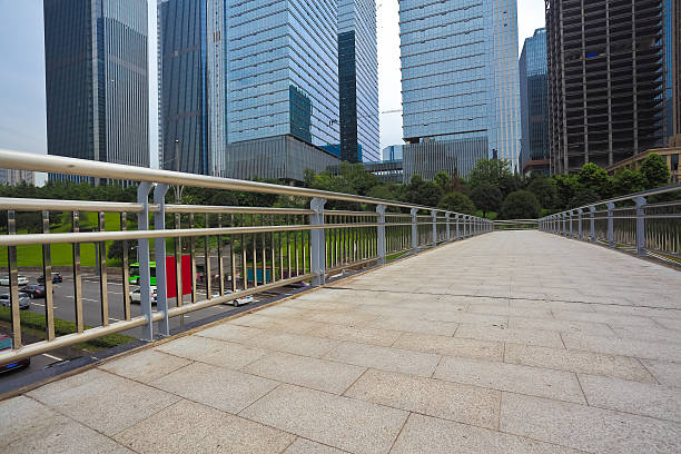istock Empty road surface with modern city buildings background 492514132