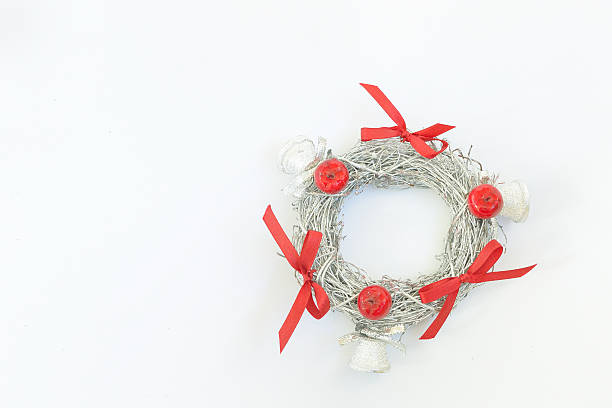 istock Decorative festive silver colored wreath with red ribbons 492515290
