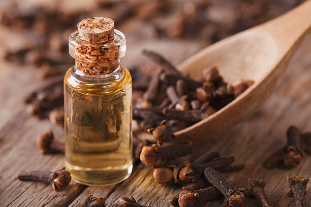 istock clove oil macro on an old desk. Horizontal 492515642