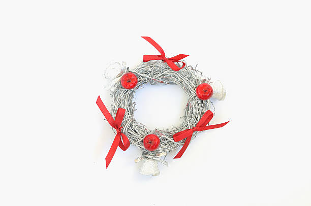 istock Decorative festive silver colored wreath with red ribbons 492515704