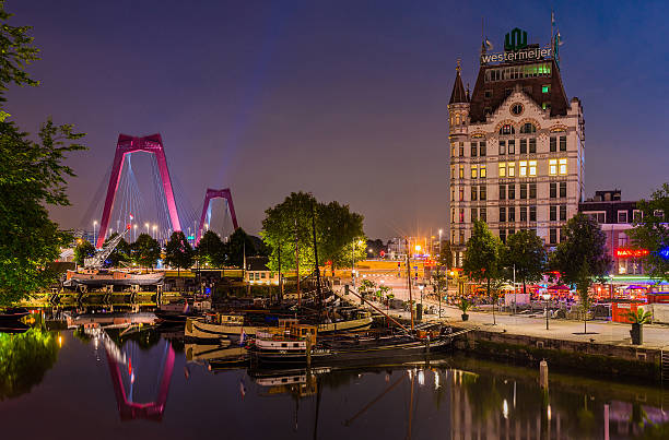 Rotterdam Cityscape Rotterdam, The Netherlands - August 7, 2014:  View of Rotterdam, a city defined by modern architecture, with very few old parts like Oude Haven, pictured here during twilight. desiderius erasmus stock pictures, royalty-free photos & images
