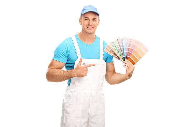 istock Painter holding color swatch and pointing to it 492519712