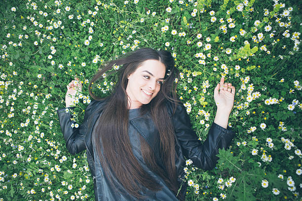 istock Young woman on grass 492527337