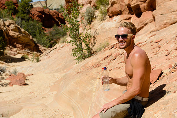istock Hiker Holding Water Bottle 492527379