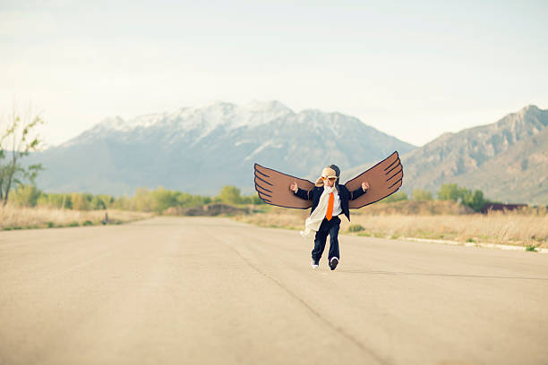 istock Young Business Boy Flying with Cardboard Wings 492527763
