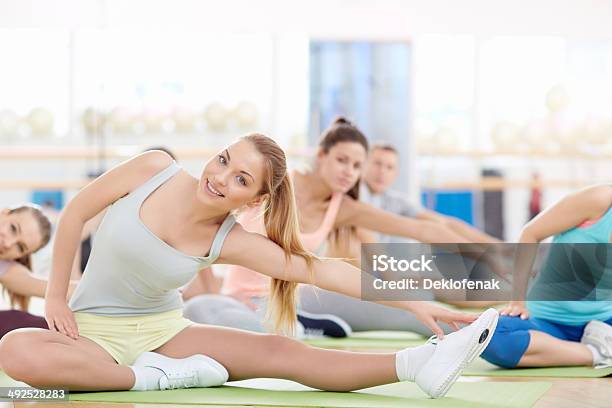 Stretching Stock Photo - Download Image Now - Active Lifestyle, Adult, Exercising