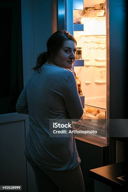 Photo Of Woman Looking In Fridge At Late Night Stock Photo - Download Image Now - Light - Natural Phenomenon, Open, Refrigerator