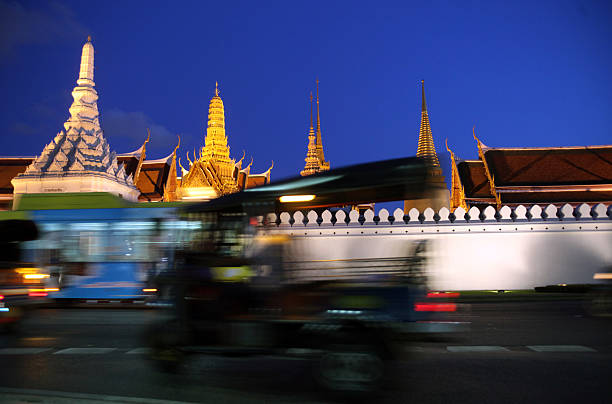The temple end in the evening mood with the Wat Phra Keo at the Royal Palace in the historic center of the capital Bangkok in Thailand.