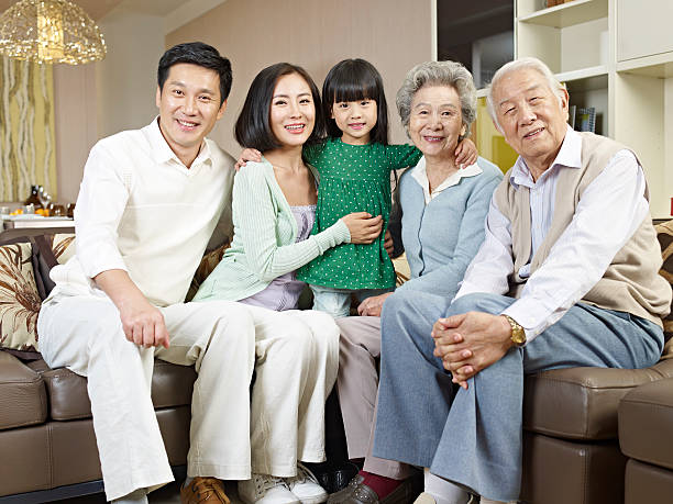 three-generation family home portrait of a three-generation family. korean ethnicity photos stock pictures, royalty-free photos & images