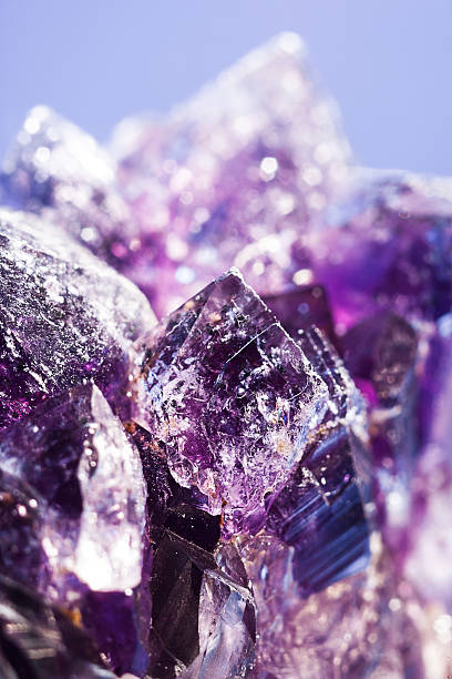 istock Purple amethyst stone over abstract background for your design 492531751
