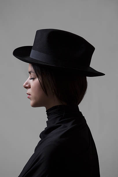 istock Girl with closed eyes wearing a hat 492532125