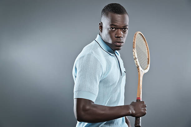 istock Retro black african tennis player wearing blue shirt. 492532449