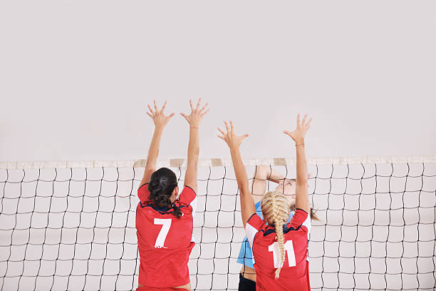 istock girls playing volleyball indoor game 492533867