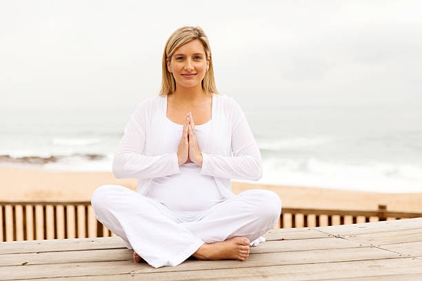 istock pregnant woman meditating 492537890