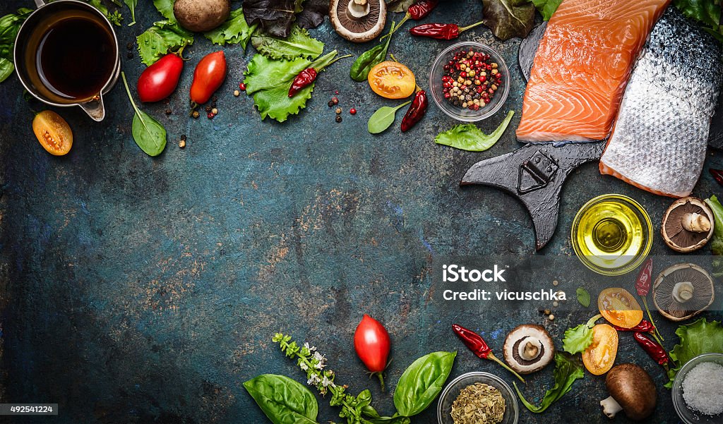 Salmon fillet with fresh ingredients for tasty cooking Salmon fillet with fresh ingredients for tasty cooking on rustic background, top view, banner. Healthy food concept Backgrounds Stock Photo