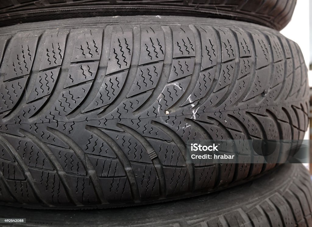 nail in tyre metallic nail in damaged tyre before repair 2015 Stock Photo