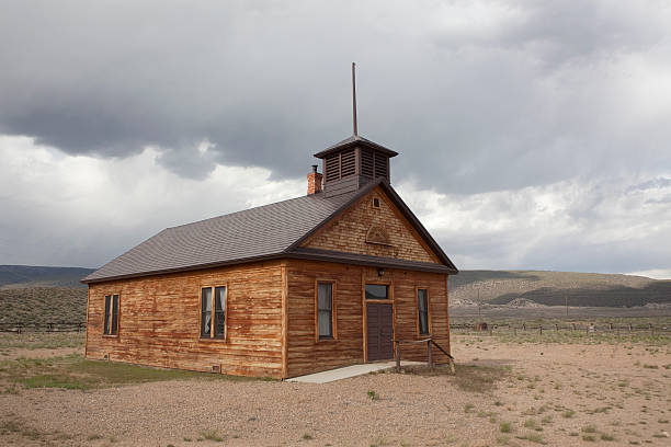 istock Storm clouds and early Colorado school house 492543071