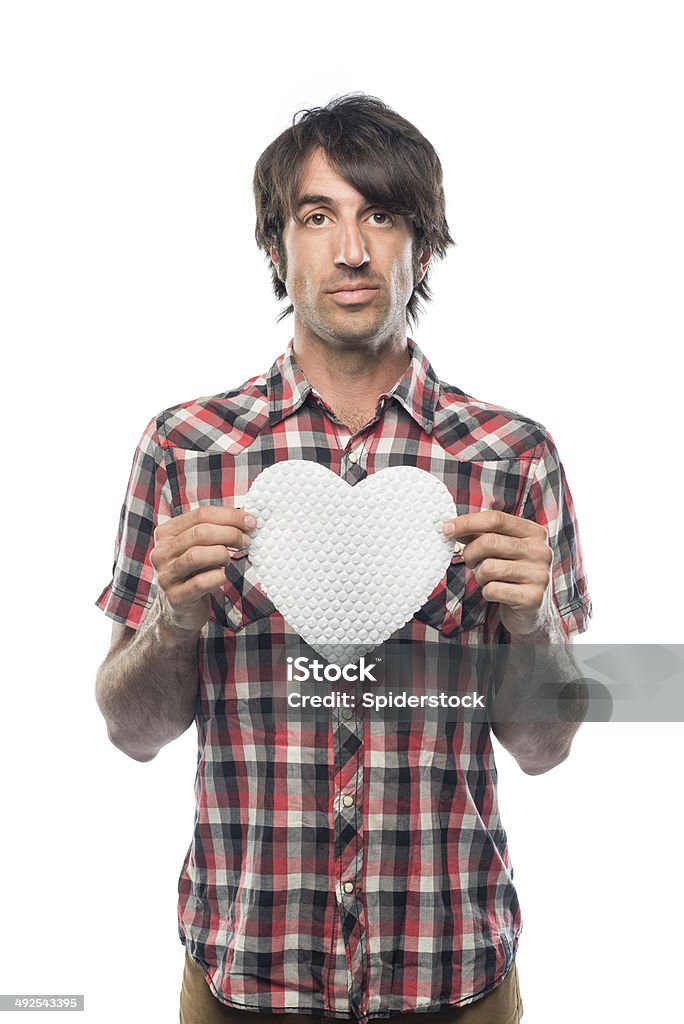 Nerd With Heart Serious nerd with red plaid shirt holding a white bubble wrap heart. Shot in the studio with a white background. Black Hair Stock Photo