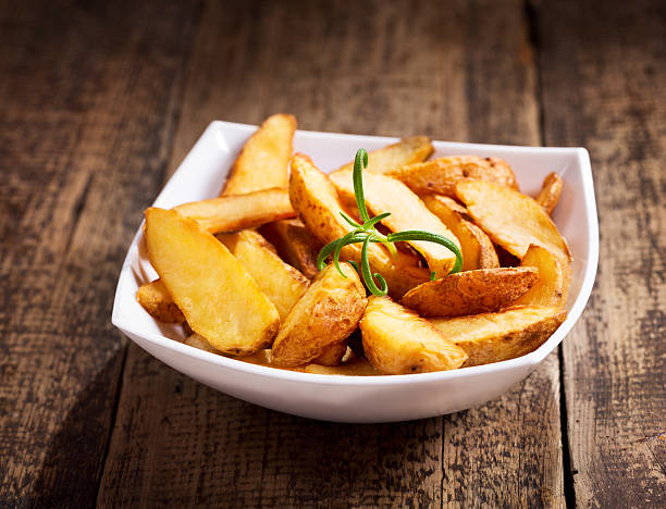istock bowl of roasted potatoes with rosemary 492543598