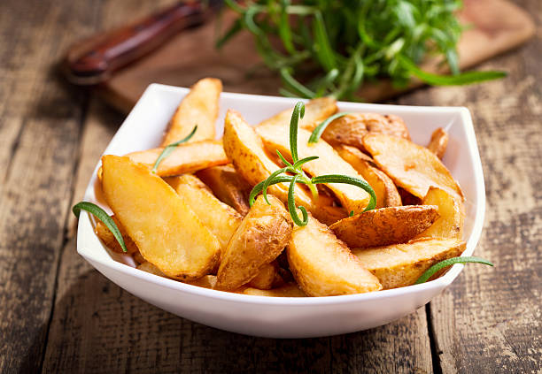 istock bowl of roasted potatoes with rosemary 492543638