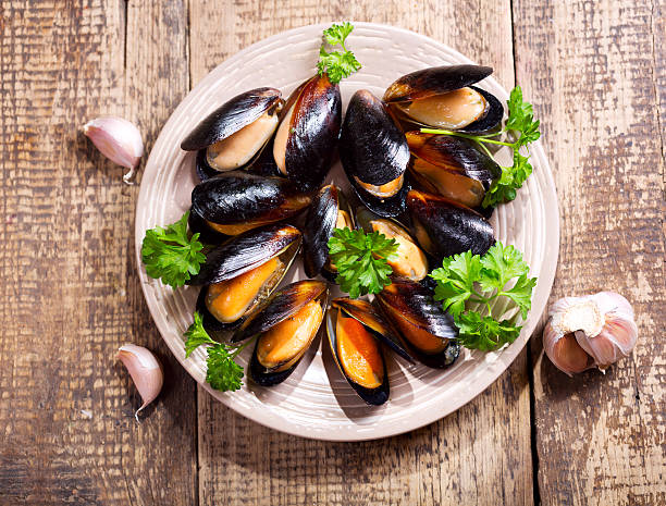 istock plate of mussels with parsley 492544072