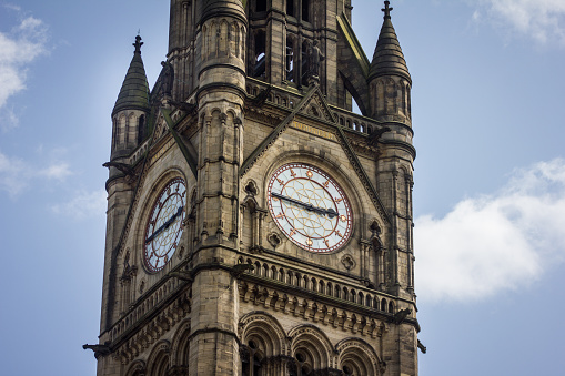 Clock tower of Manchester Town Hall, UK. Gothic style Grade I listed building built 1877