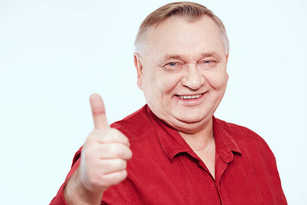 istock Senior showing thumb up sign 492545662