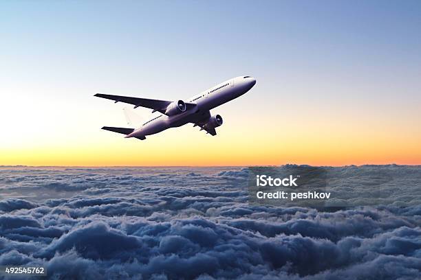 Airplane In The Sky At Sunrise Stock Photo - Download Image Now - 2015, Air Vehicle, Airplane