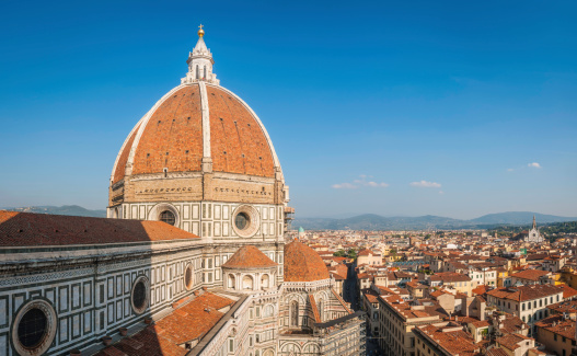 Panoramic view across the Tuscan terracotta rooftops and medieval streets to the magnificent dome of the Duomo of Florence, Itay. ProPhoto RGB profile for maximum color fidelity and gamut.