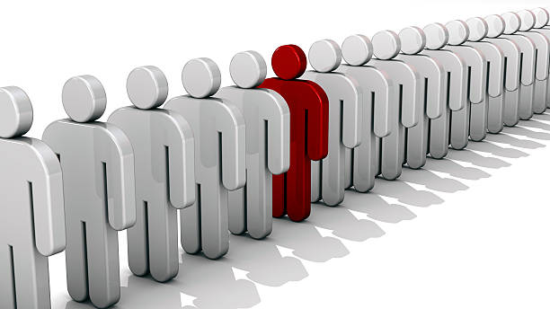 istock Single red 3D people figure in row of white figures. 492548250