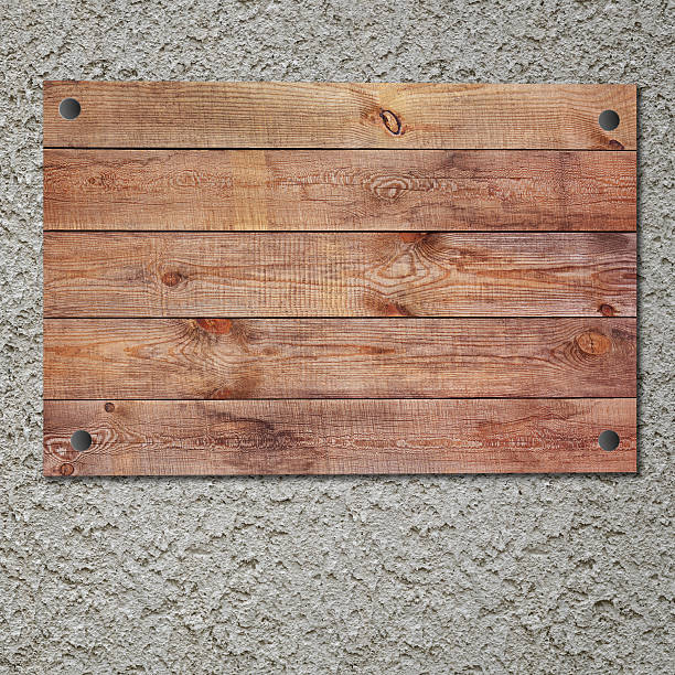 istock Vintage wooden sign on stucco concrete wall. 492548929