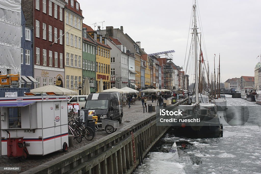 Nyhavn im Winter The district of Nyhavn in winter with partly frozen areas. Capital Cities Stock Photo