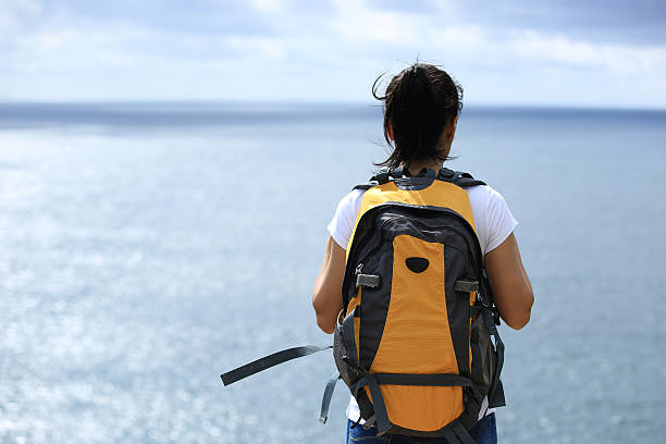 istock young woman hiker seaside 492549415