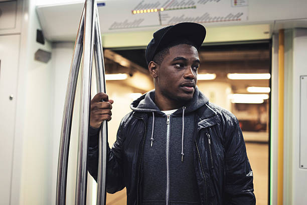istock Afro man with cap standing in metro. 492549610