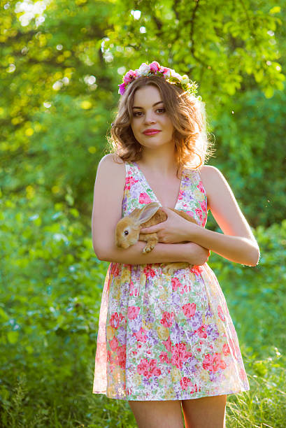 istock Beautiful girl with curly hair with rabbit 492549718