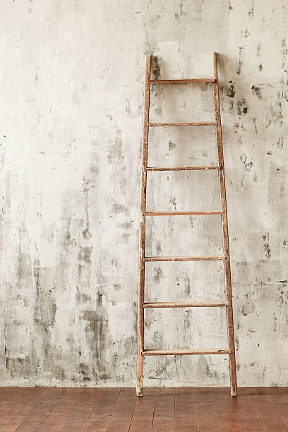 istock Wooden staircase in an empty room 492549926